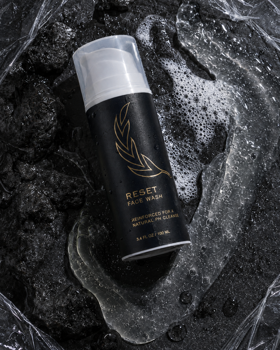 Reset face wash surrounded by cleansing texture and water